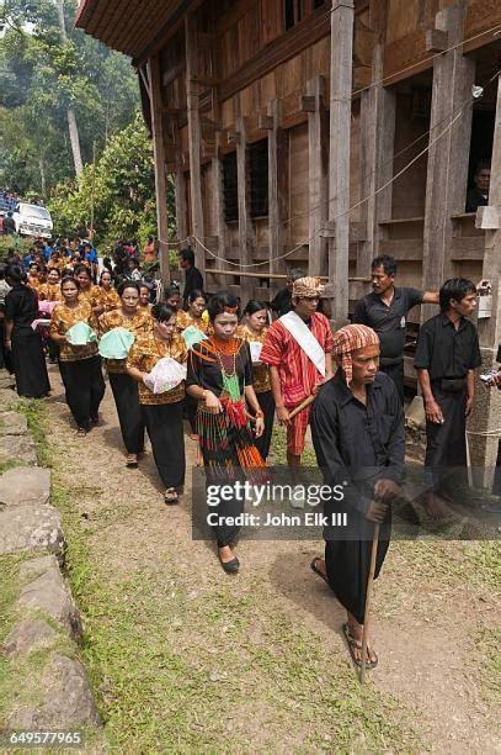  Members of the Torajan tribe recreate a family wedding snap with the long-dead bride and groom