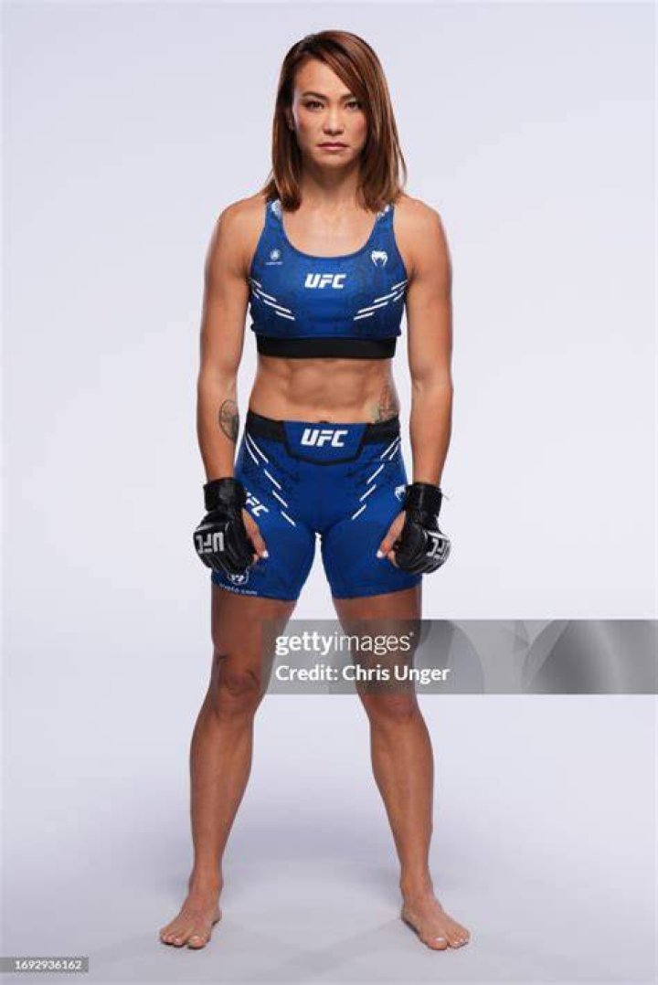  Michelle Waterson poses on the scale during the UFC 249 official weigh-in on May 8 in Jacksonville, Florida