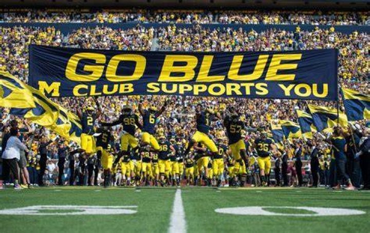 Michigan Wolverines' running back coach was taken off the field during the first half against the Indiana Hoosiers at Memorial Stadium on October 8