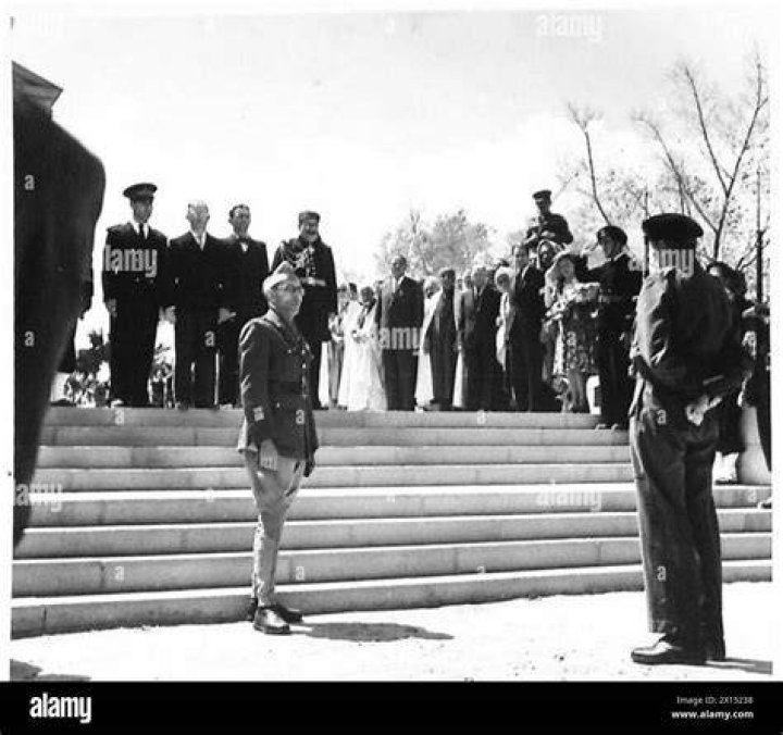  Montgomery (left) stands next to his XXX Corps commander, Brian Horrocks, and other staff officers as they review maps on the hood of a staff car
