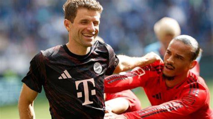 Muller gives the midfielder a pat on the head after their coming together