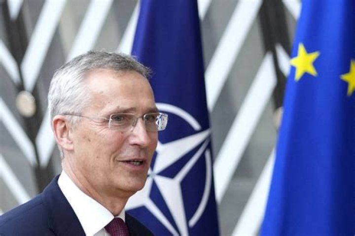 Nato Secretary General Jens Stoltenberg speaks with US Marines during Exercise Cold Response 2022