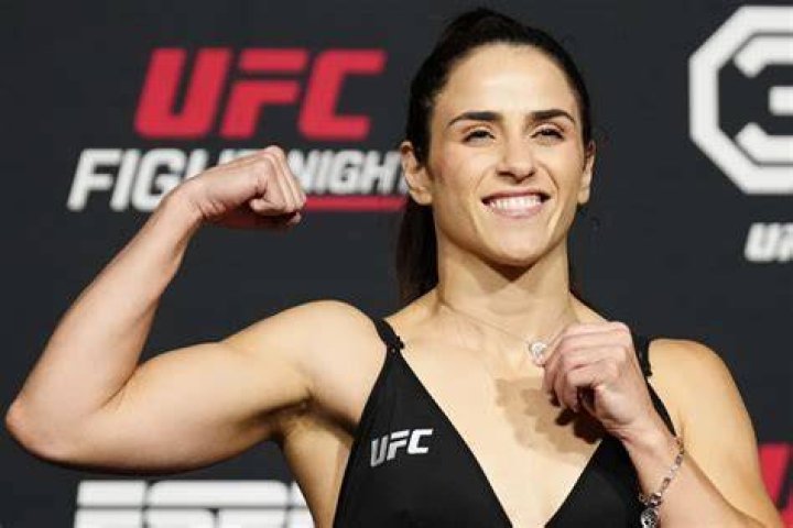 Norma Dumont's top starts to ride up during her fight with Ashlee Evans-Smith