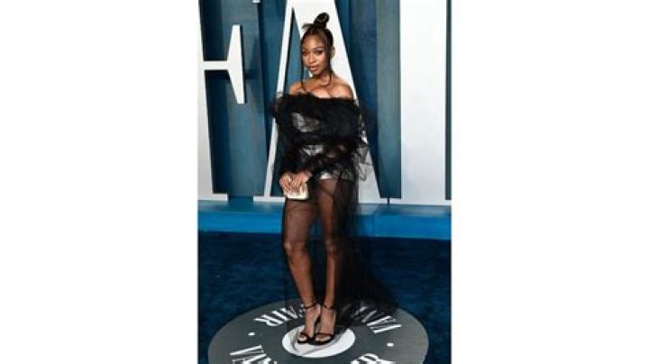 Normani stunned in a lavish mustard-colored ball gown complete with puffy sleeves