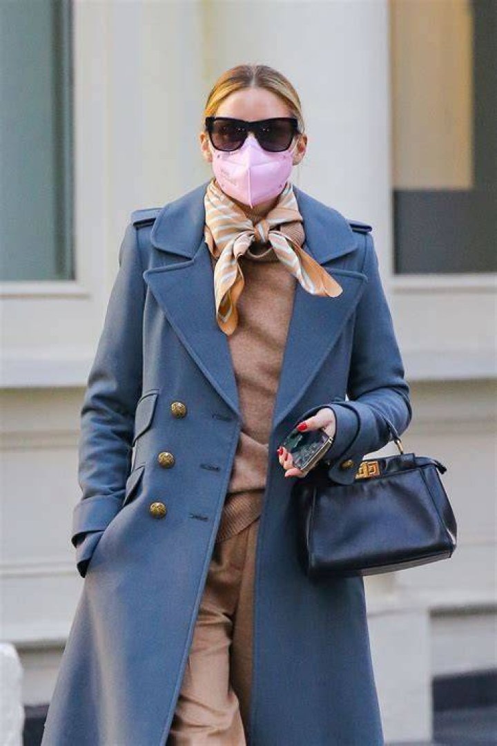 Olivia Palermo looks very stylish running errands in Brooklyn wearing a scarf over her face 