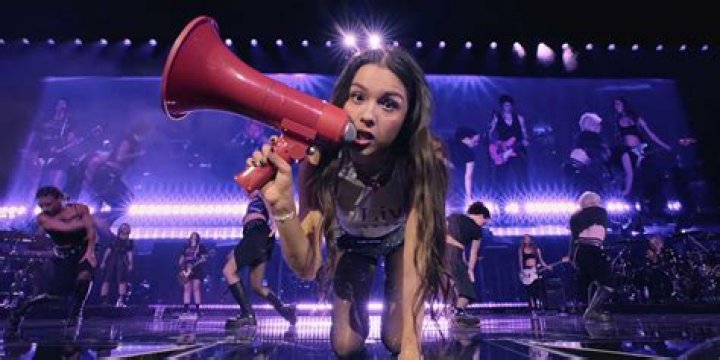 Olivia took to a megaphone for the first verse of Get Him Back!