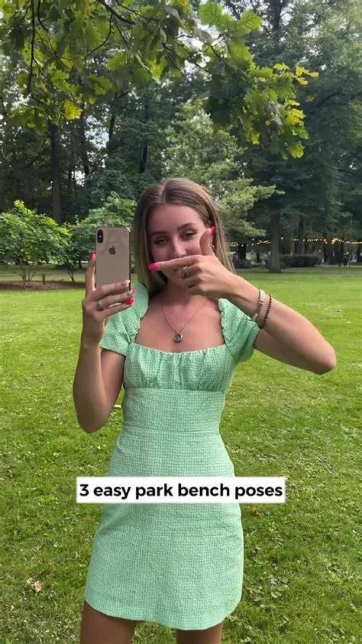 Ona poses on park bench