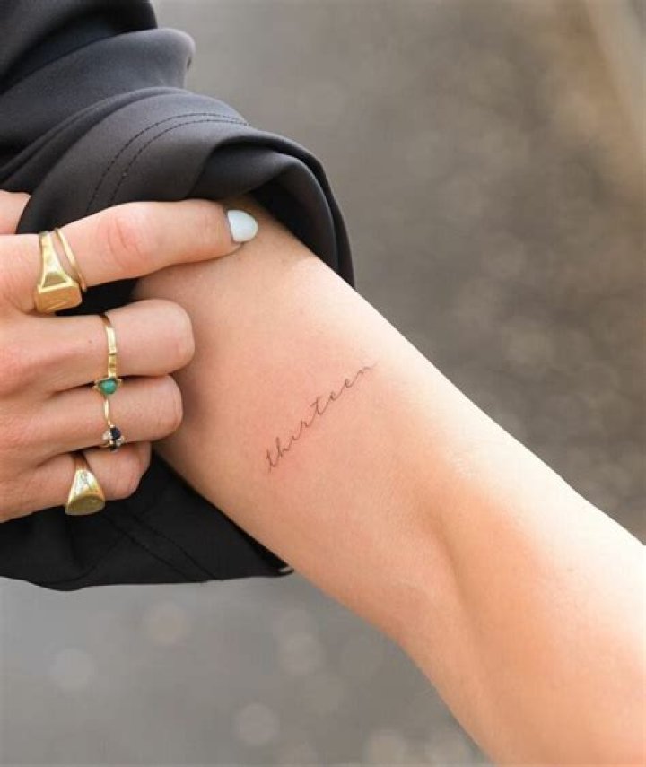 One of the tattoos is a quote from a song she doesn't listen to anymore