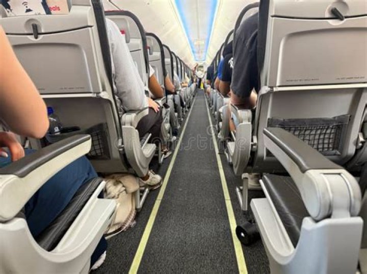 Passengers are seen inside the train after the derailment