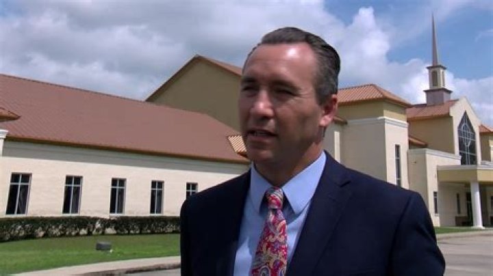  Pastor Tony Spell talks with journalists before attending Sunday service on April 5.