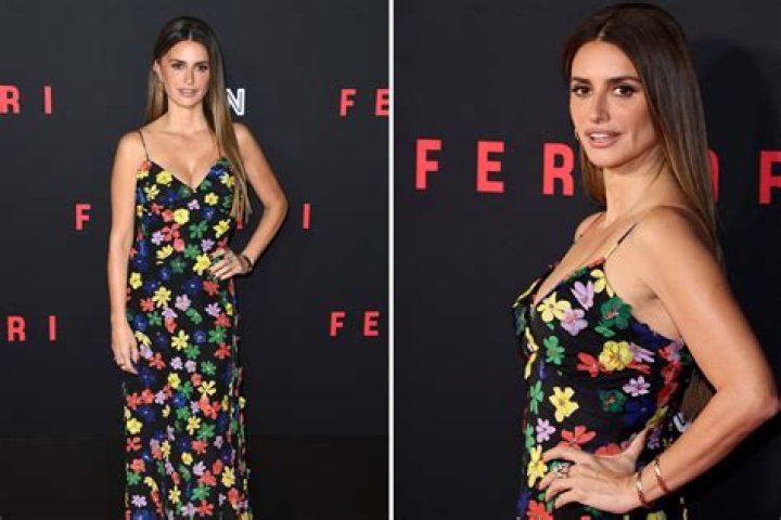 Penelope Cruz has gone braless in a dangerously low-cut floral-print gown as she showed off her curves on the red carpet