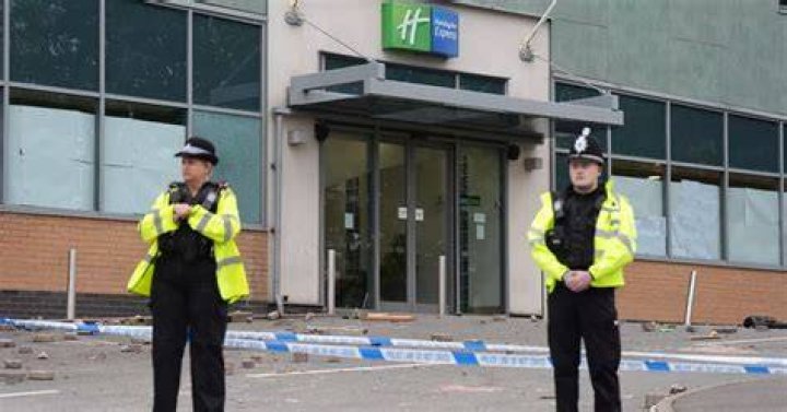 Police guard the hotel after the incident