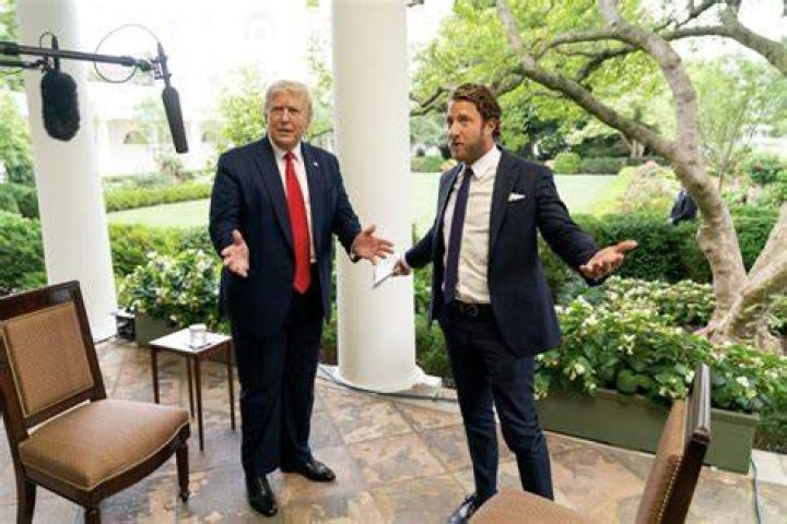 Portnoy posing with President Donald Trump, with whom Portnoy interviewed