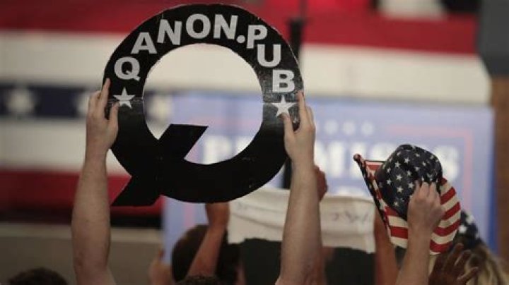 QAnon banners were seen outside the Capitol building during the rioting