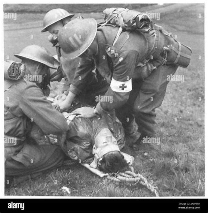  RAMC personnel and wounded British Soldiers take cover in a trench