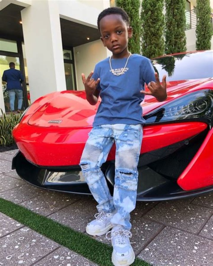 Rapper Messiah Bentley regularly poses in front of supercars