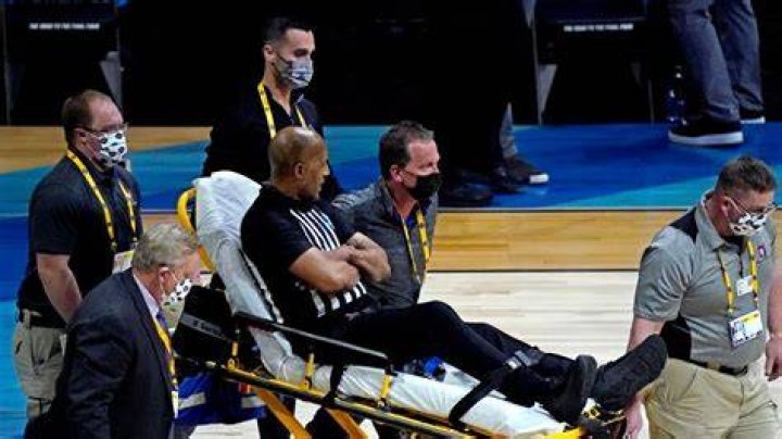 Referee Bert Smith fell on the court during the first half of the game between USC and Gonzaga