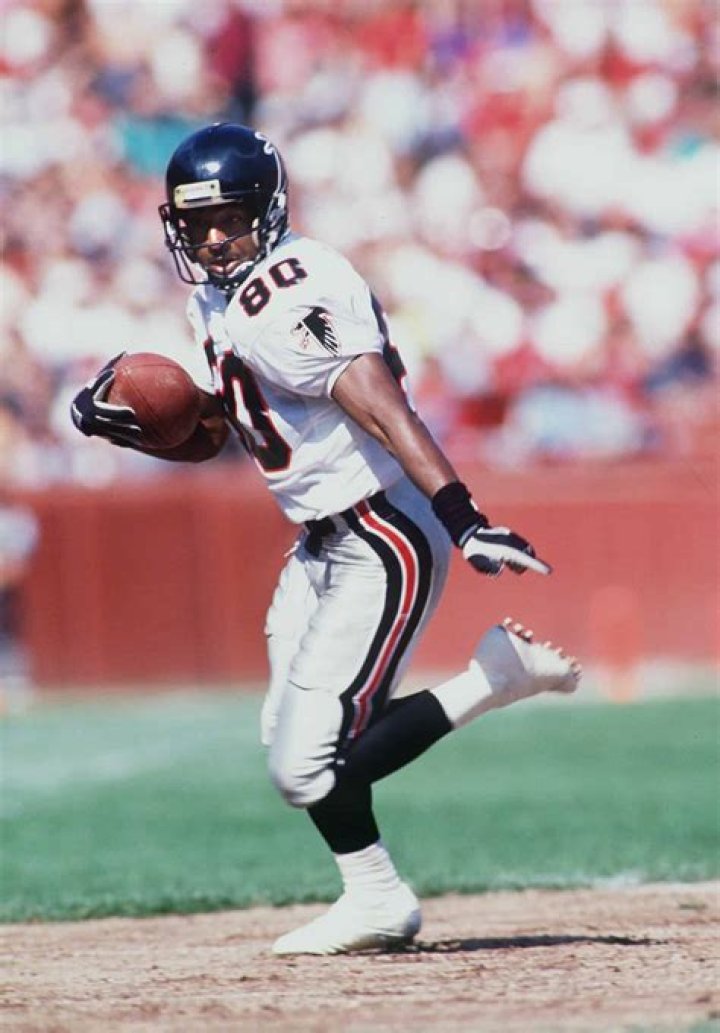 Rison (L) caught for 77 yards and a touchdown in Super Bowl XXXI