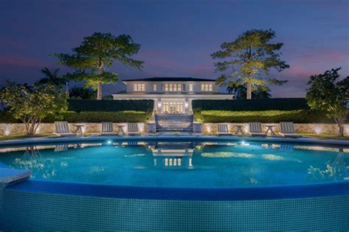  Robbie has a swimming pool in his massive garden