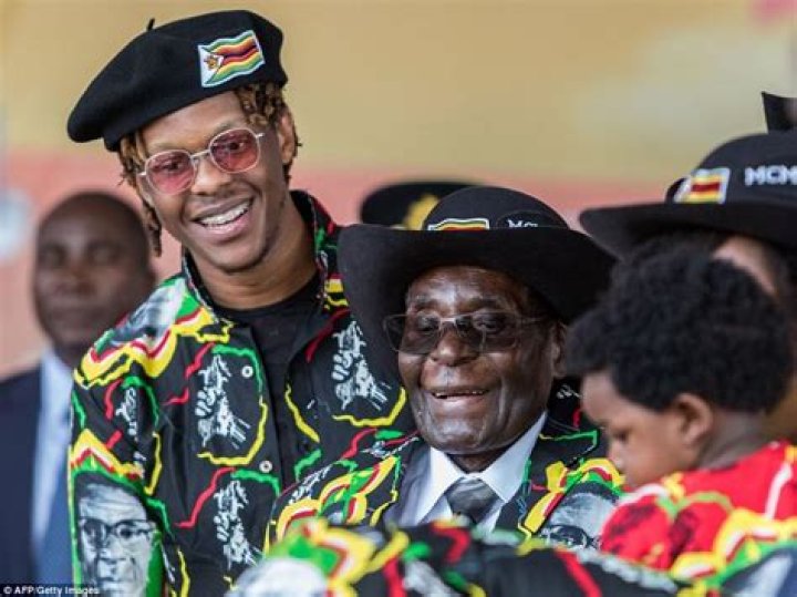 Robert Mugabe Jr flanks his famous father