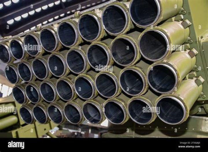Rocket launcher tubes are seen in the wreckage of a car