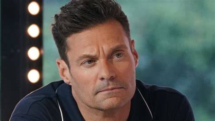 Ryan Seacrest has been brutally mocked by Kelly Clarkson over his hair in a throwback photo