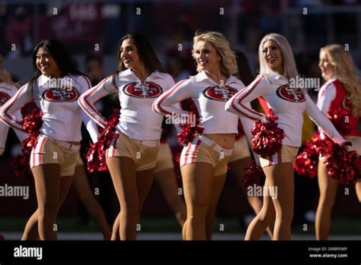  San Francisco 49ers cheerleaders perform during the NFL Super Bowl Opening Night at Marlins Park in Miami