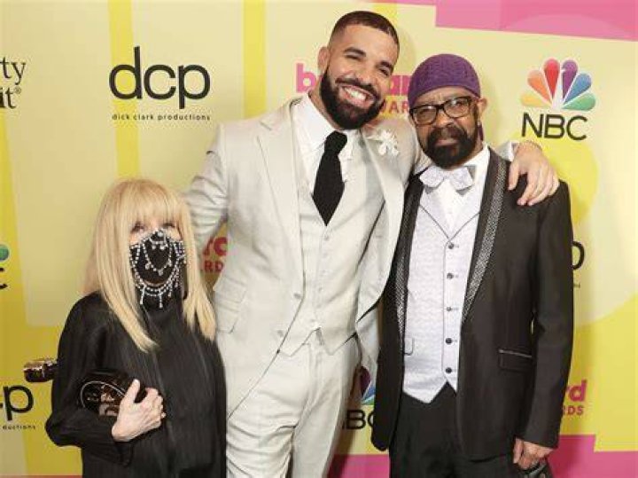 Sandi Graham, Drake, and Dennis Graham pose backstage during the 2021 Billboard Music Awards