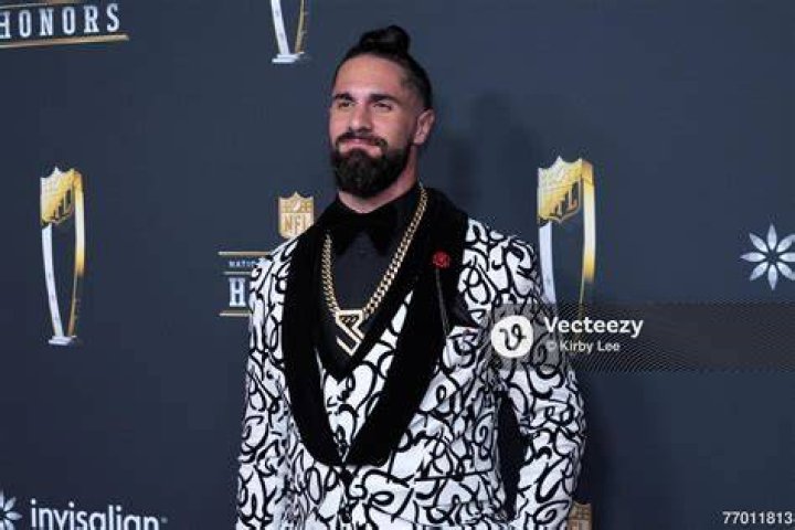 Seth hit the red carpet in an orange jacket