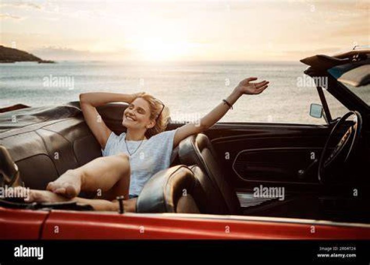 She is enjoying a trip with friends, and stopped to show off her figure amid the fun