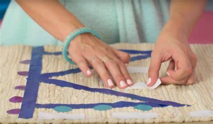 She uses the tape as an outline to trim any long hairs