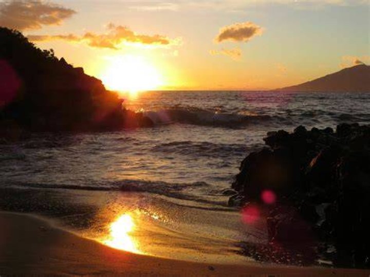 She watched the sun set on the beach with her fiance