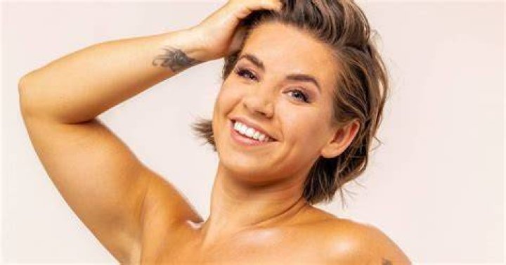She went topless in just a black thong bikini