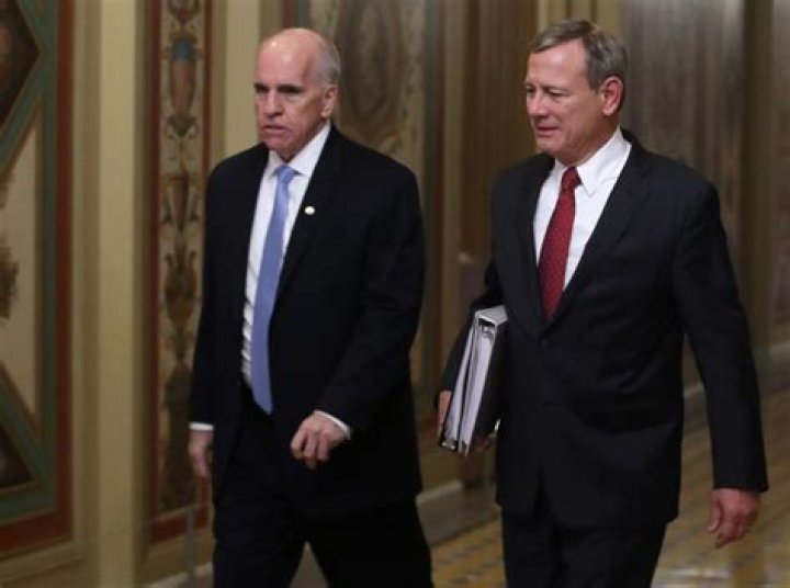 Stenger escorts Chief Justice of The U.S. Supreme Court John Robert after leaving the Senate Chamber