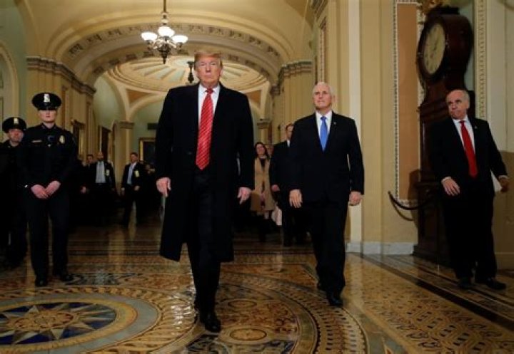 Stenger escorts Trump and Pence as as they arrive to attend a closed Senate Republican policy lunch