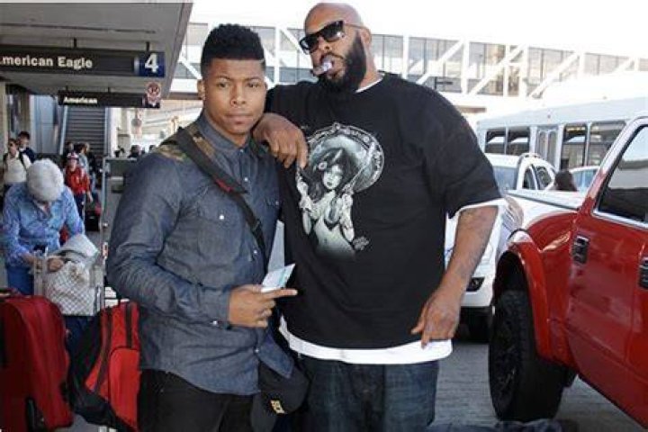 Suge pictured with his father before he was imprisoned