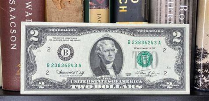 The $2-bill is in perfect condition