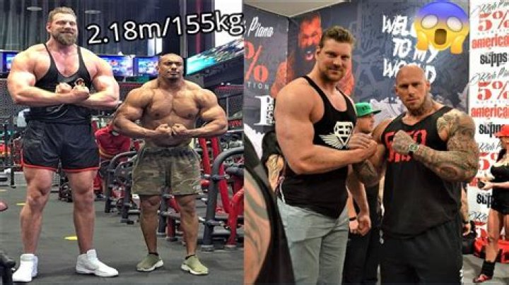 The bodybuilder stands taller than the other women on stage at Romania Muscle Fest