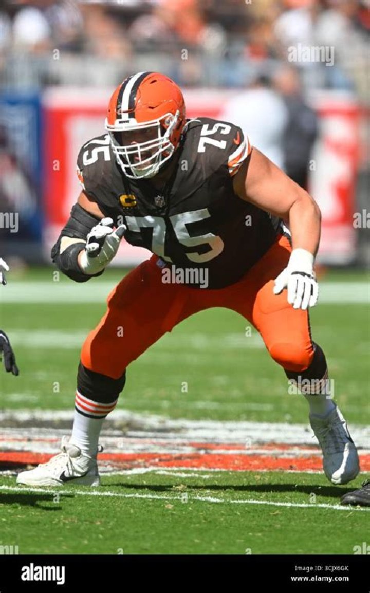 The Cleveland Browns guard was caught on camera carrying a 200lb beast around on his shoulders