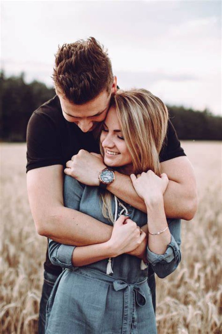 The couple pose together at a friend's wedding