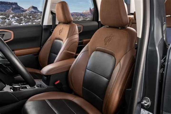 The embellished leather interior features hand-stitched elements honoring the brand's creator and the car it was inspired by, the Type 57 SC Atlantic