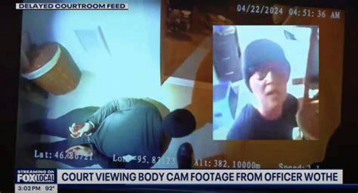 The footage shows a body slumped over a prison block railing