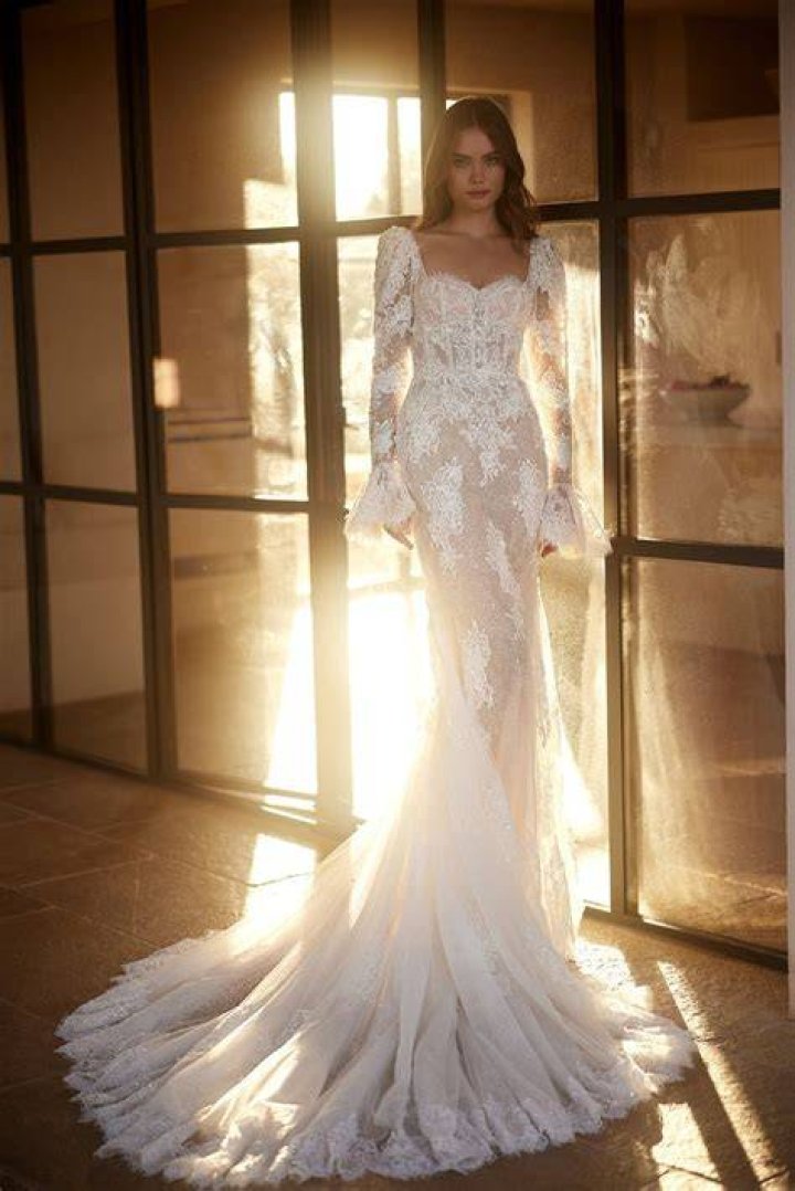 The form-fitting dress accentuated the rapper's curvy figure though the material may have shown off more than intended as she was frequently seen covering her breasts