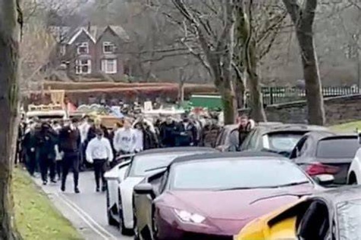 The funeral cortege was led by the Artane band and a lone piper