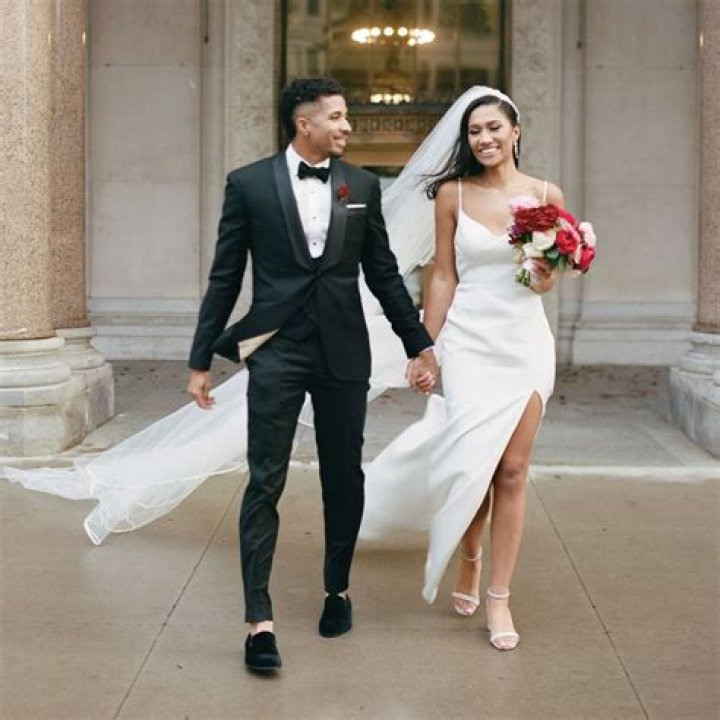 The groom's sister decided to ignore the dress code and wear a black dress instead