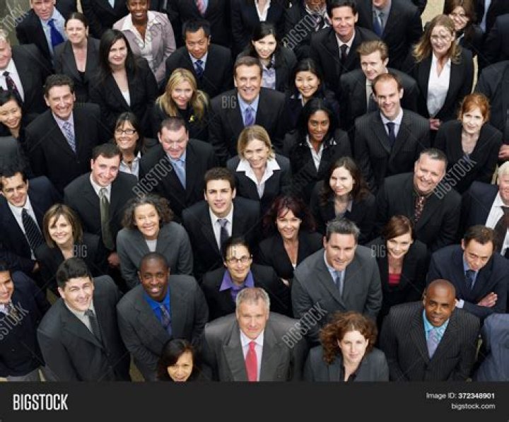 The group of people had been watching her as they knew she was the manager of a local bank