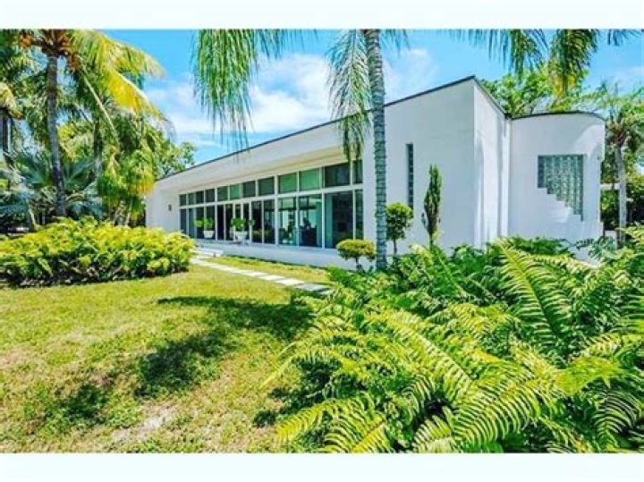 The home boasts 15 foot ceilings and merges indoor with outdoor living