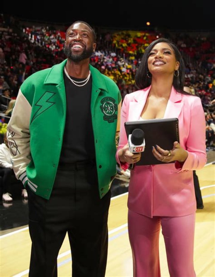 The host pictured with NBA icon Dwyane Wade at the 2023 All-Star Game