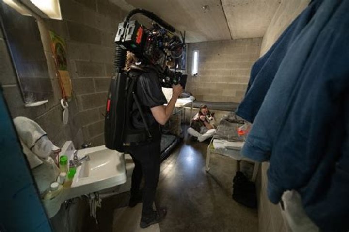 The inmate filming the scene shows the time on his watch