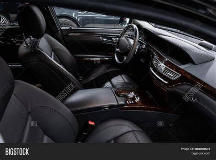 The interior of the car is light pink with a floral pattern